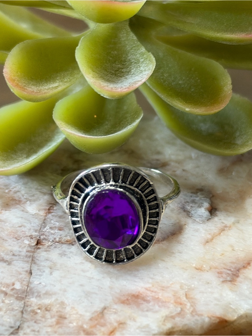 Ring with Oval Purple Gemstone